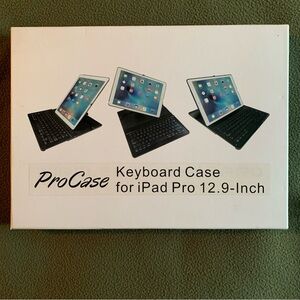FUC ProCase keyboard case for iPad Pro 12.9”. Black and silver. Charging cord.
